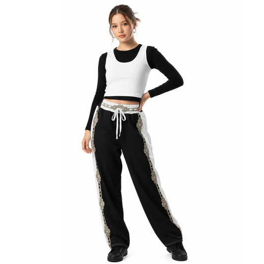 Black wide-leg joggers with contrast stripe, elastic waist, and white drawstring ties