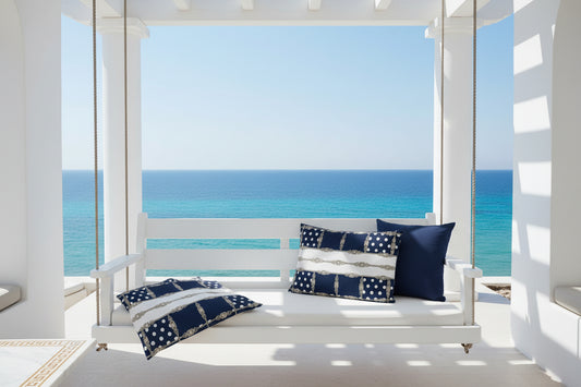Navy cushion cover with white dots and gold chain jewel lattice pattern on a lounge sofa