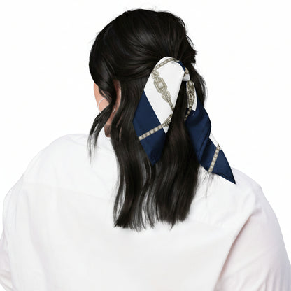 Person with black shiny hair, tied back with a decorative navy blue & white scarf tied in a ribbon shape. Back view shot.