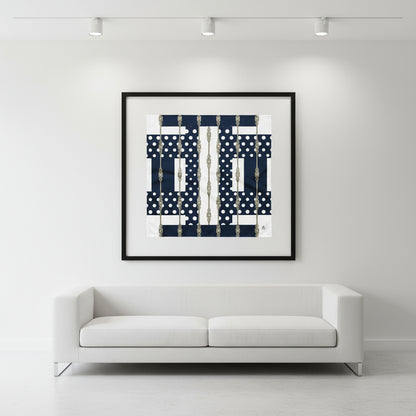 Framed abstract art piece on a white wall above a white sofa. Scarf is displayed inside the glass frame. 
