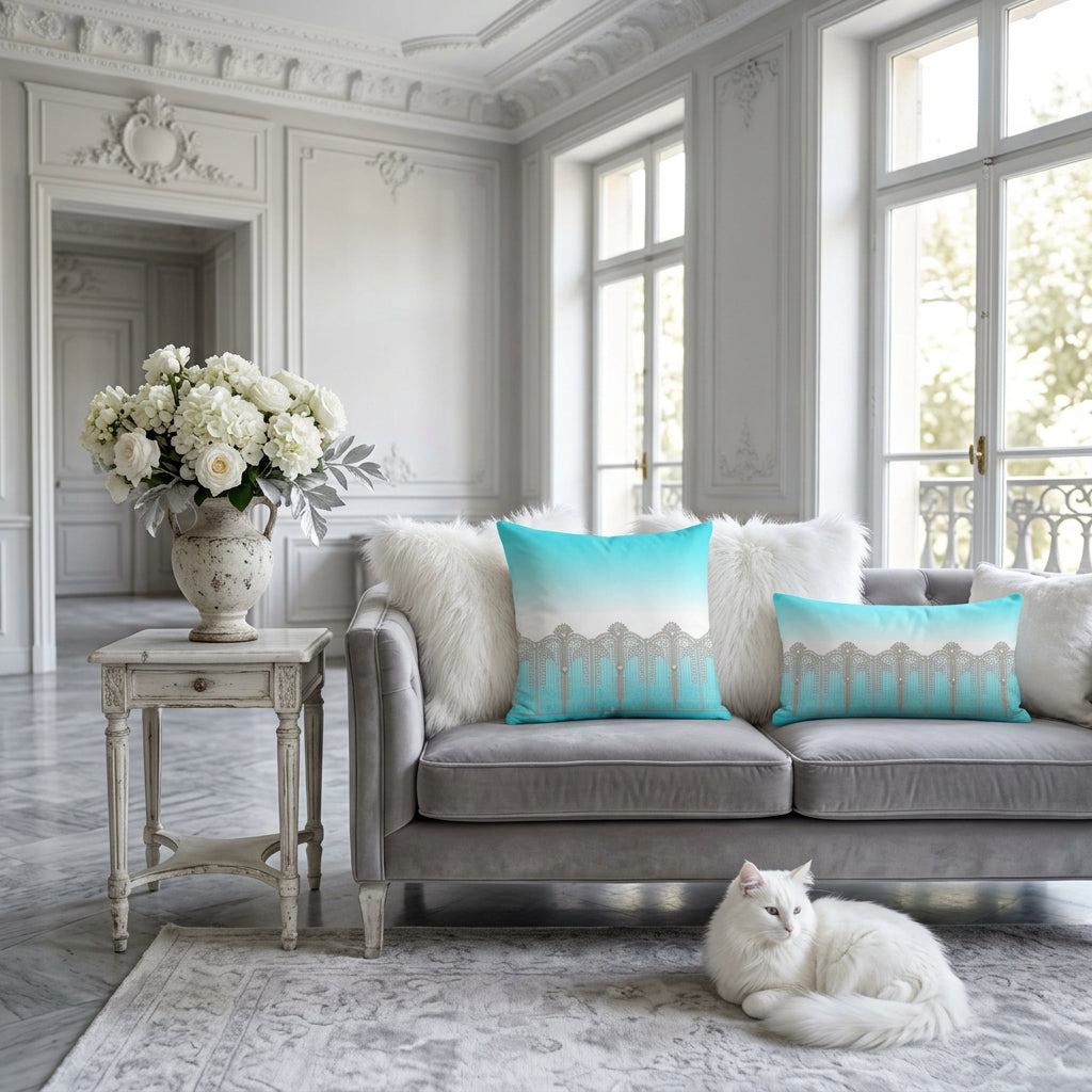 A square throw pillow featuring a printed design of a silver Art Deco style silver gate against a turquoise and white gradient background. Square shape and lumbar cushions are displayed stylishly in a classy french interior decor.