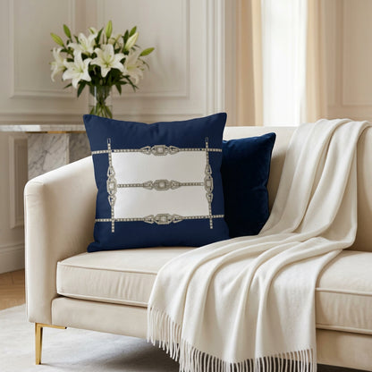 A square throw pillow featuring a navy blue background with a white rectangular center and an Art Deco style diamond necklace design in silver and clear stones.