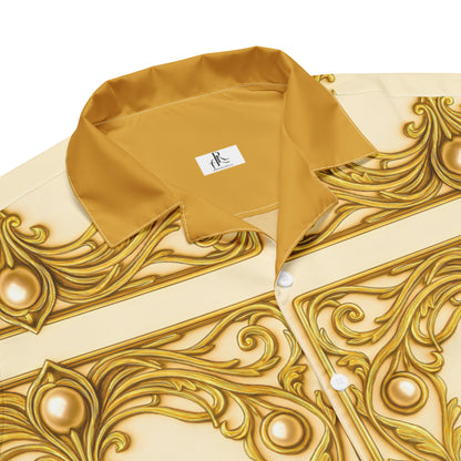Close-up of a collared button-up shirt in warm camel beige with an ornate metallic gold baroque-style print, featuring a visible neck label with the brand name RSV.