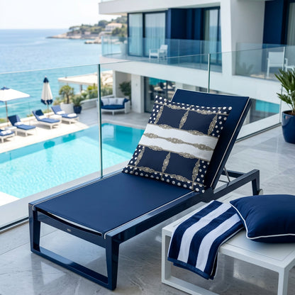 Navy cushion cover with white polka dots and silver geometric jewel chain lattice pattern, displayed on the navy bench at the hotel balcony, over looking at the pool.